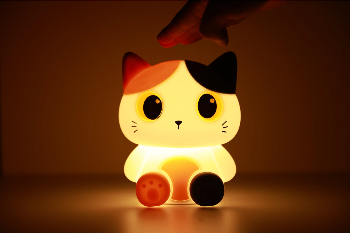 Oranje siliconen nachtlampje voor kinderen met schattig katontwerp, zacht LED-licht, perfect voor kinder- en babykamers.