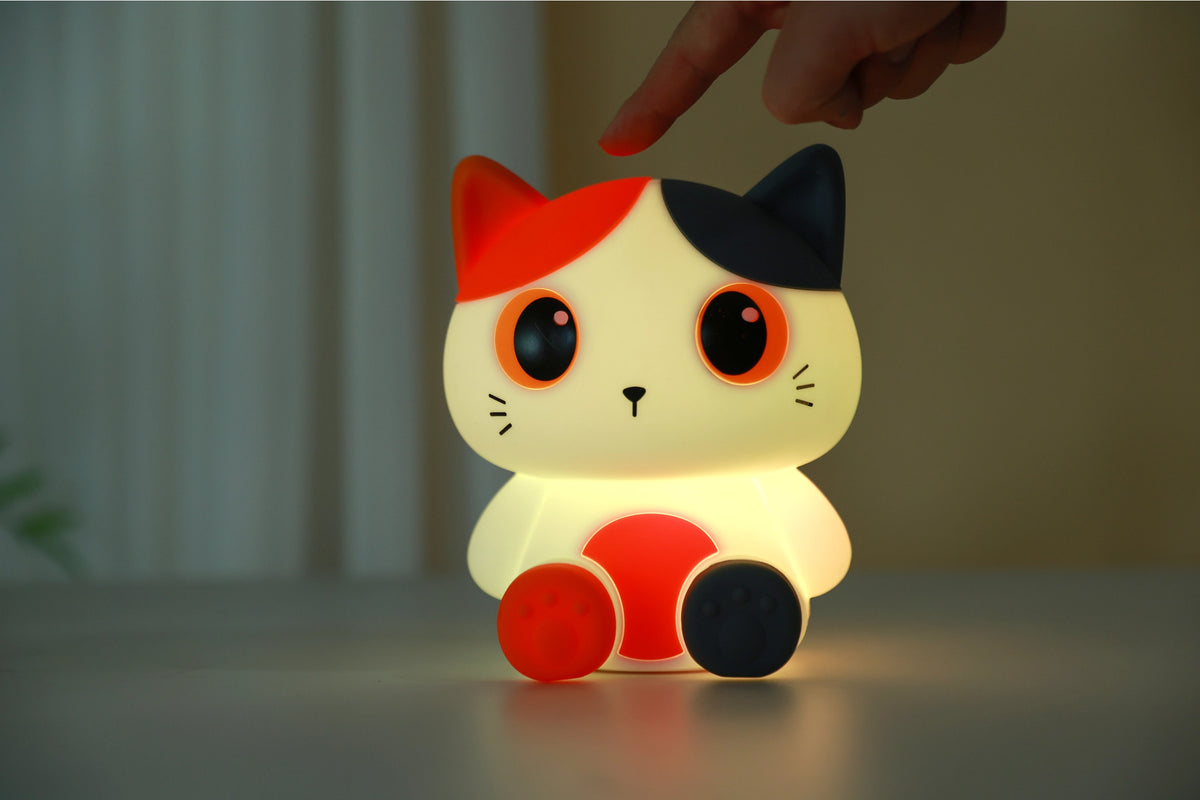 Oranje siliconen nachtlampje voor kinderen met schattig kat-ontwerp, zachte LED-verlichting, geschikt als sfeervol kinderkamer decor.